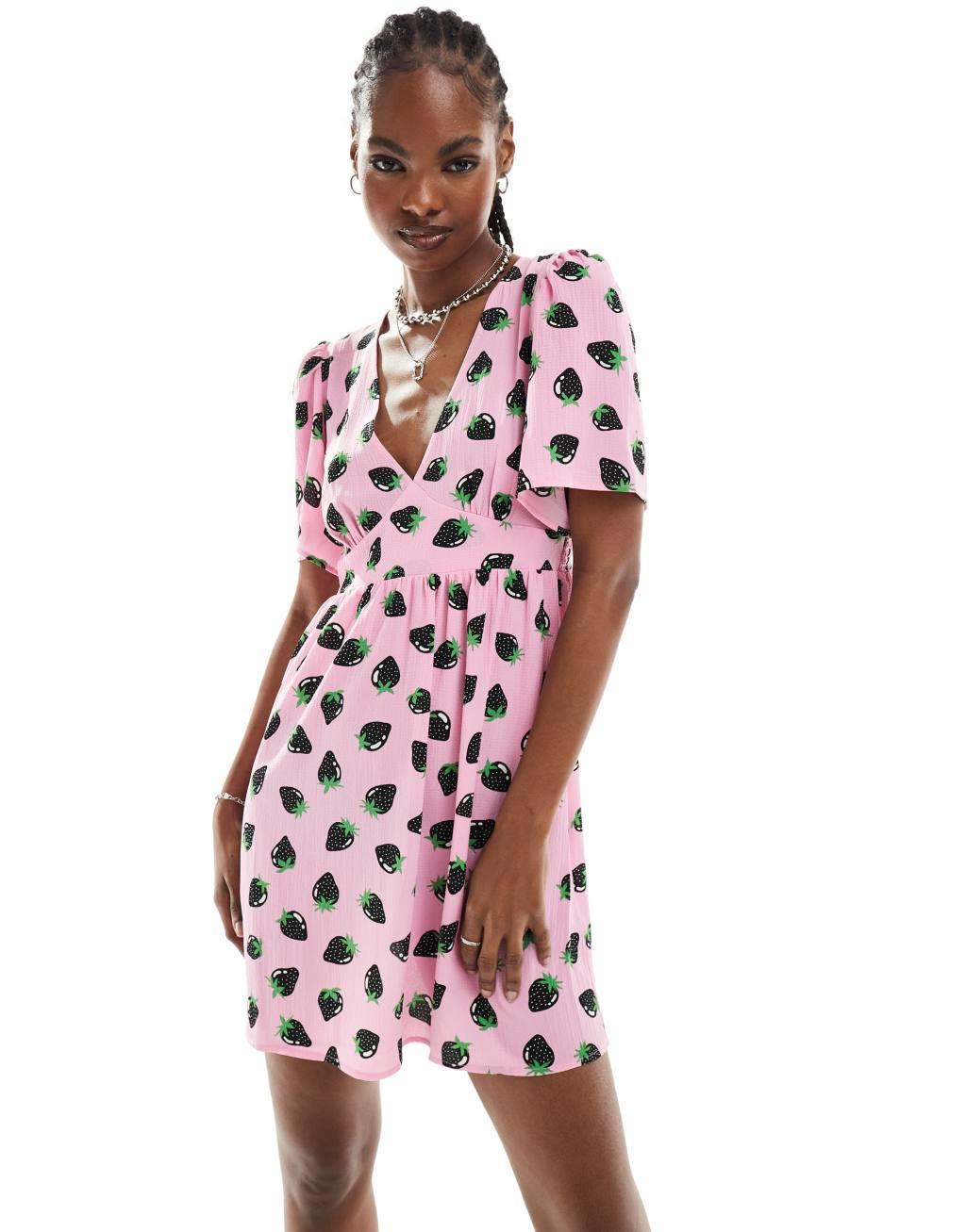 Monki short sleeve mini sun dress with v neck in pink and black strawberry print Product Image