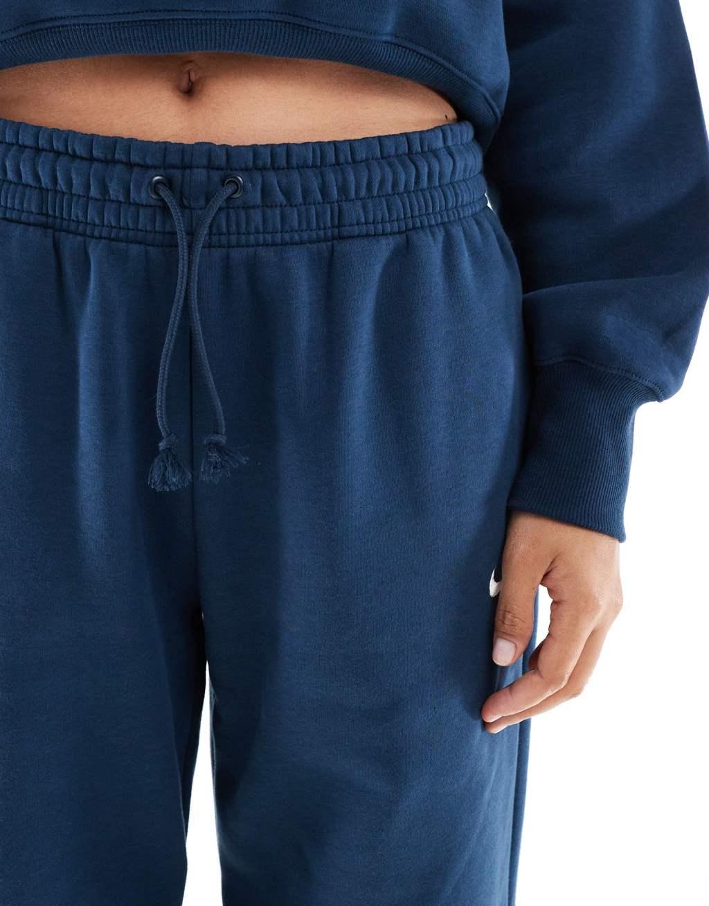 Nike Mini Swoosh sweatpants in navy Product Image