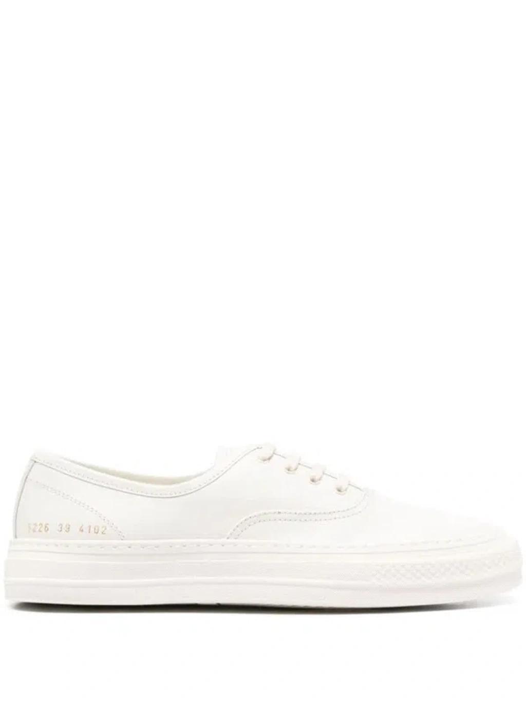 COMMON PROJECTS Four Hole Leather Sneaker In White Product Image