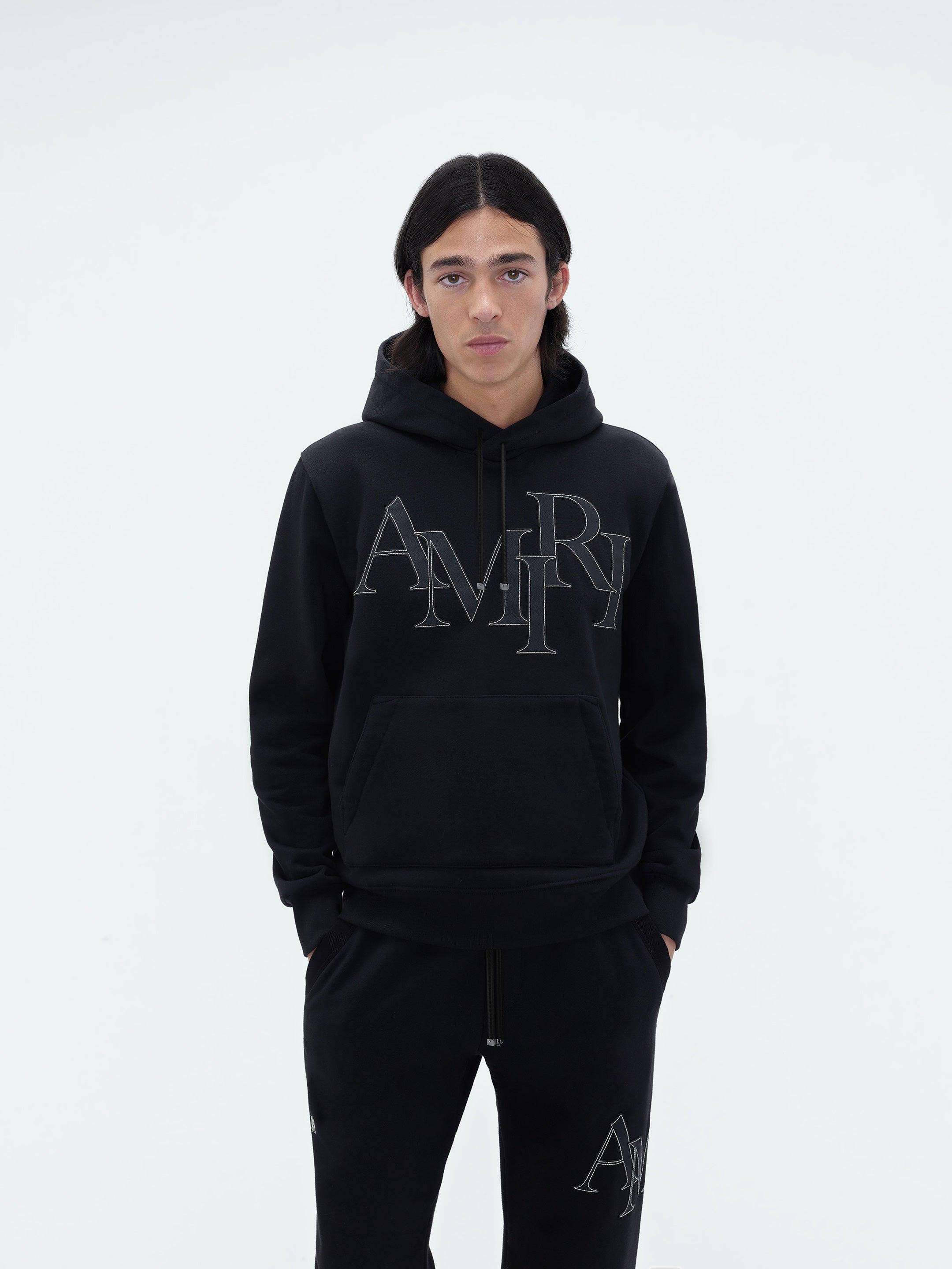 AMIRI STAGGERED LOGO HOODIE - Black Male Product Image