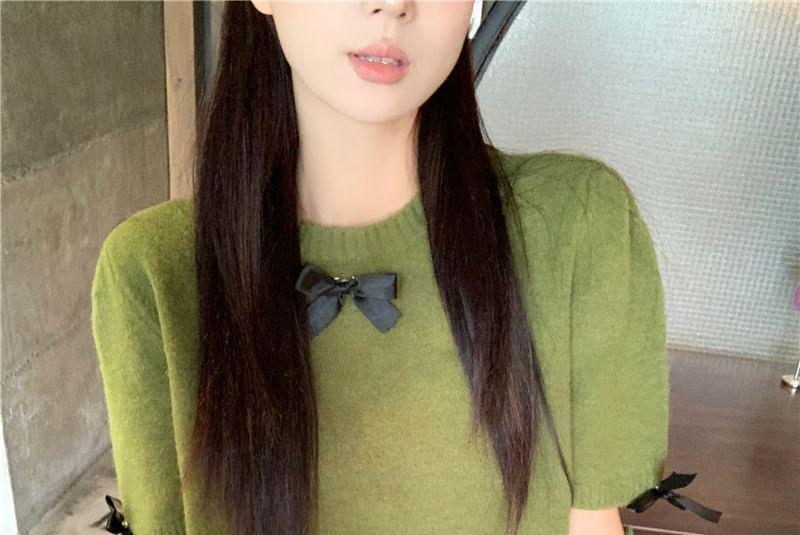 Set: Short-Sleeve Round Neck Plain Bow Knit Top + Arm Sleeves Product Image