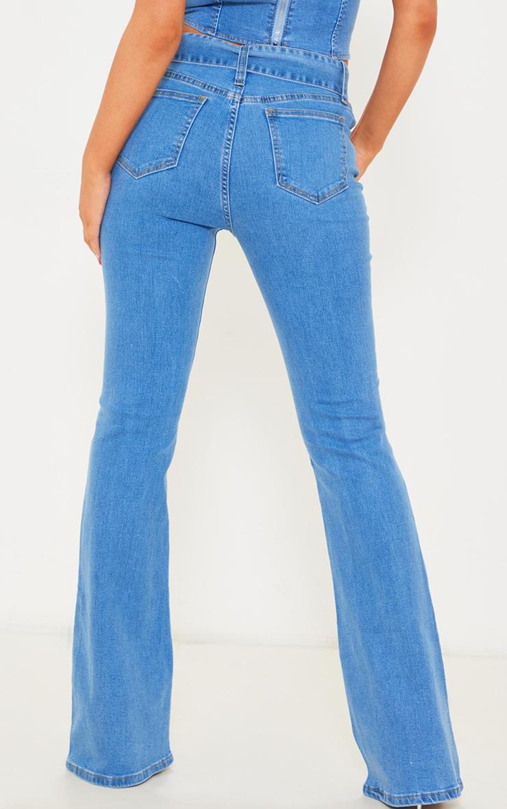 Light Blue Wash Belted Flared Jeans Product Image