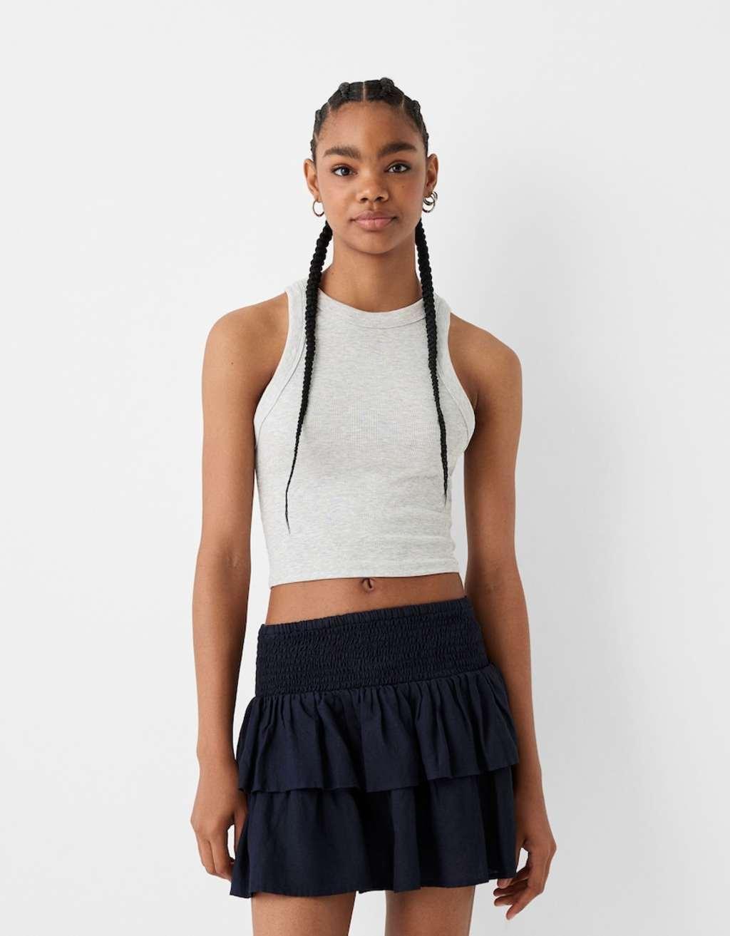 Bershka shirred waist rara mini skirt in navy Product Image