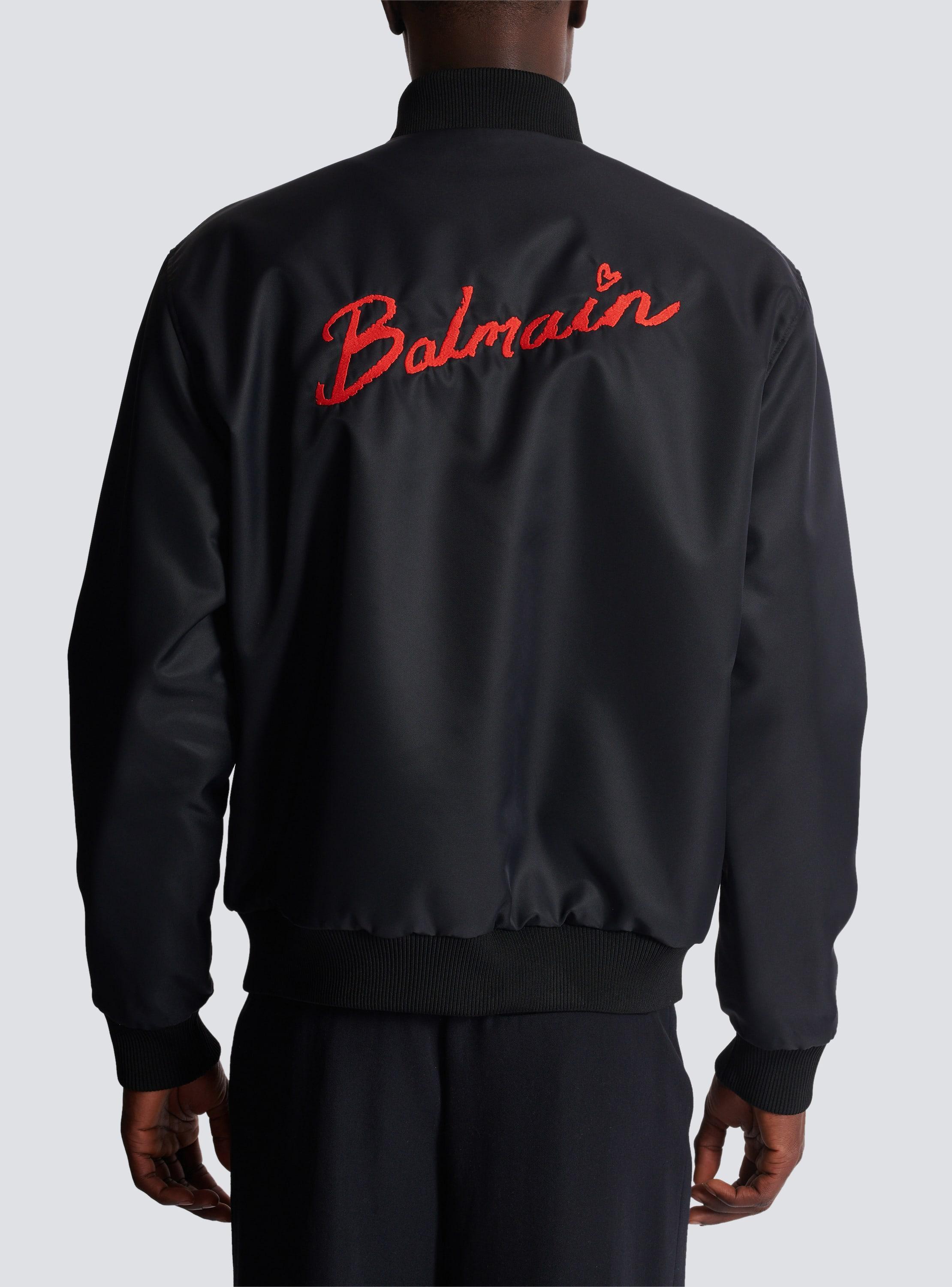 Reversible bomber jacket in plain and Kiss-print nylon Product Image