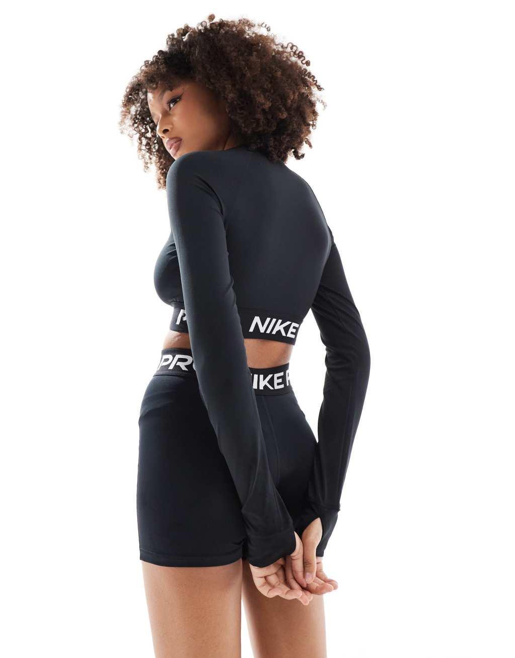 Nike Training Pro 365 cropped long sleeve top in black Product Image