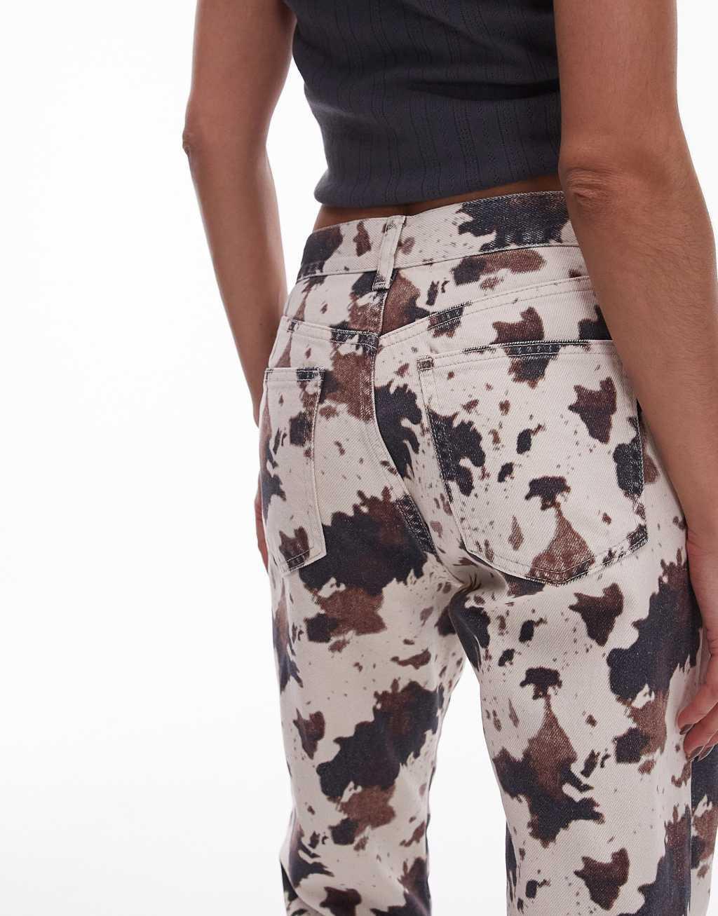 Topshop mid rise 90s flare jeans in cow print Product Image