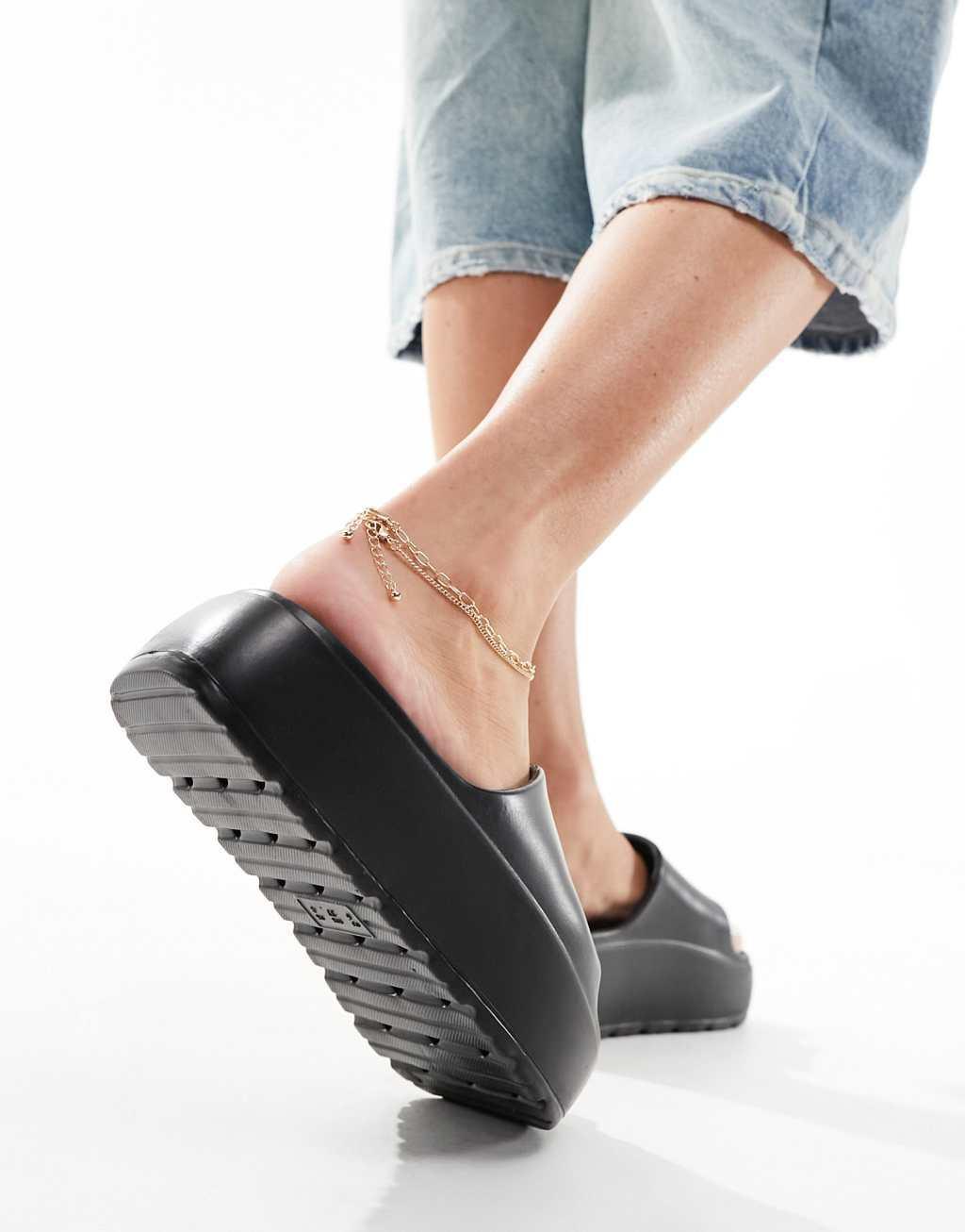 ASOS DESIGN Freedom cleated flatform slides in black Product Image