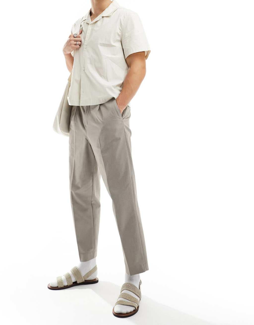 Selected Homme loose fit cropped pleat pants in beige Product Image