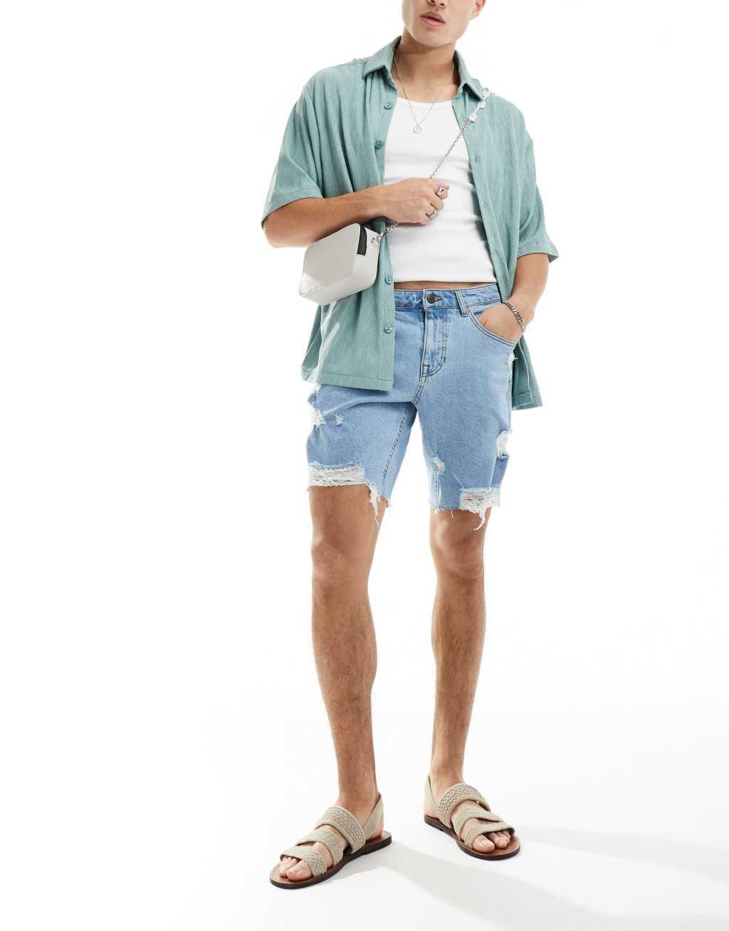 ASOS DESIGN long length denim shorts with abrasions in light wash blue Product Image