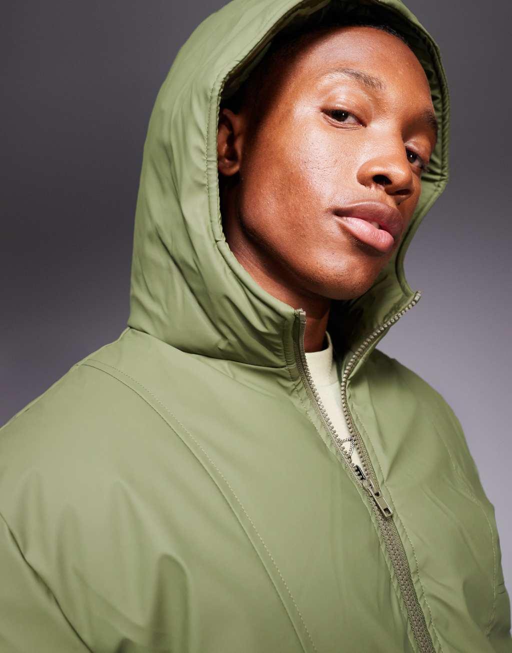 ASOS DESIGN rain resistant rubberized puffer jacket in green Product Image