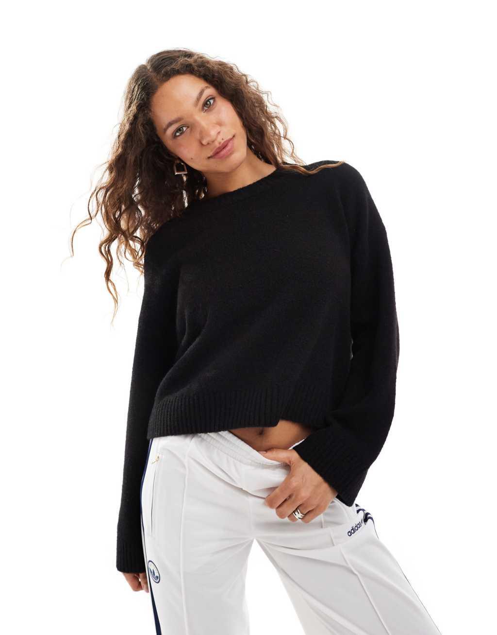 Monki round neck relaxed knit sweater in black Product Image