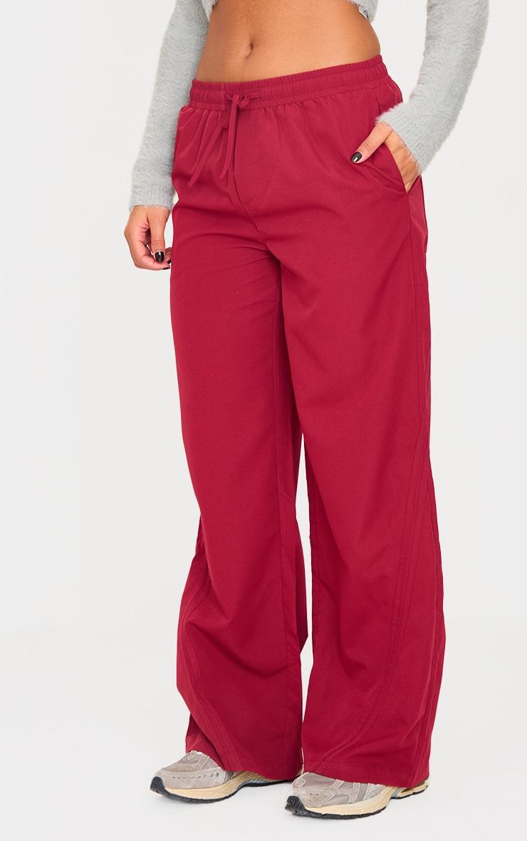 Burgundy Asymmetric Side Stripe Detail Track Pants Product Image