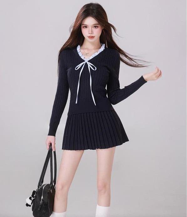 Set: Long-Sleeve V-Neck Bow Knit Top + Mid Rise Plain Mini Pleated Skirt Product Image