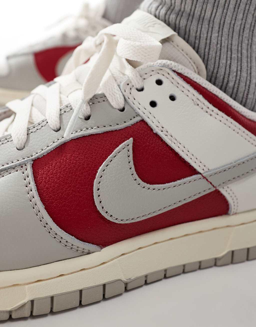 Nike Dunk Low Retro sneakers in off white and red Product Image