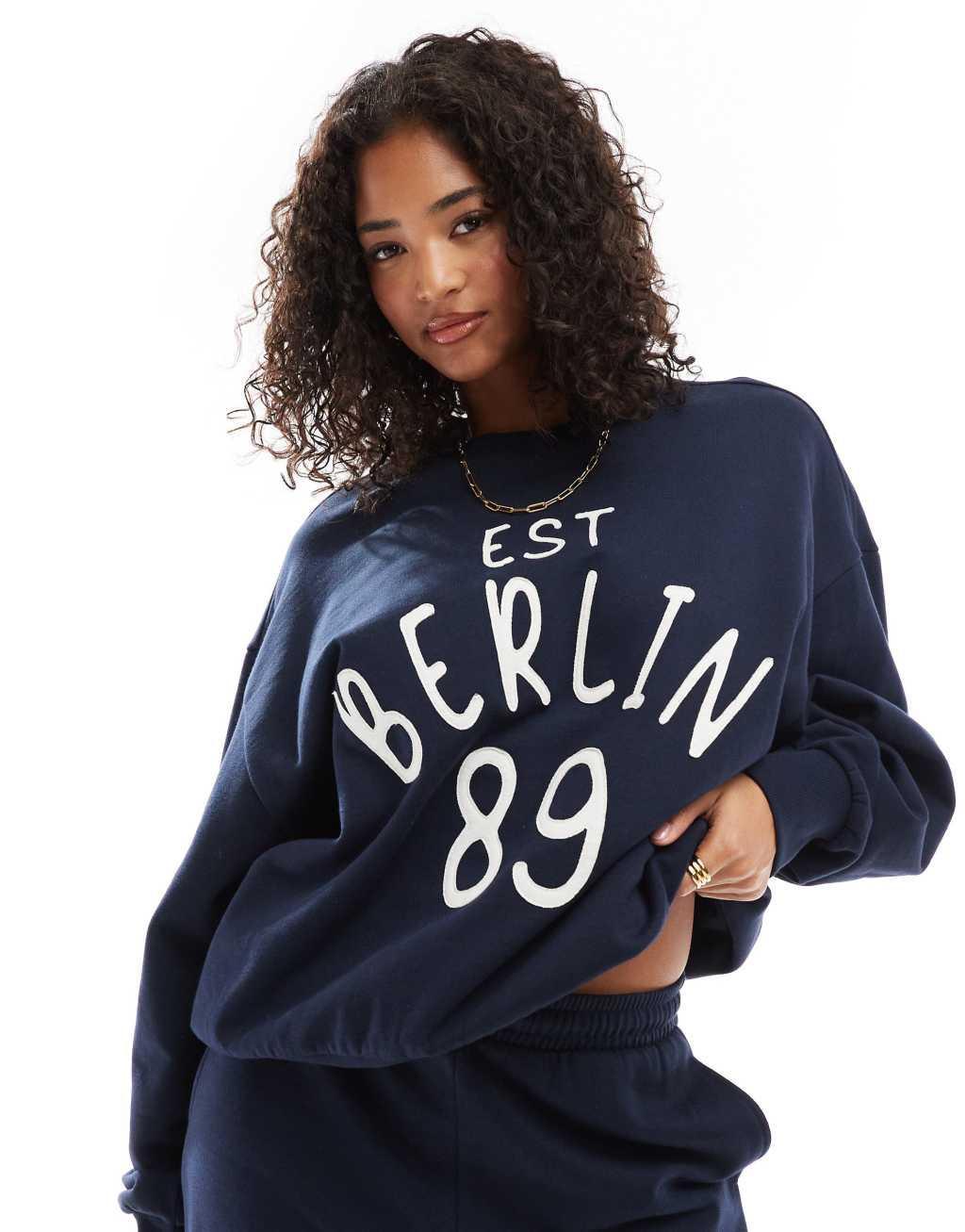 ASOS DESIGN sweat with applique berlin graphic in navy - part of a set Product Image