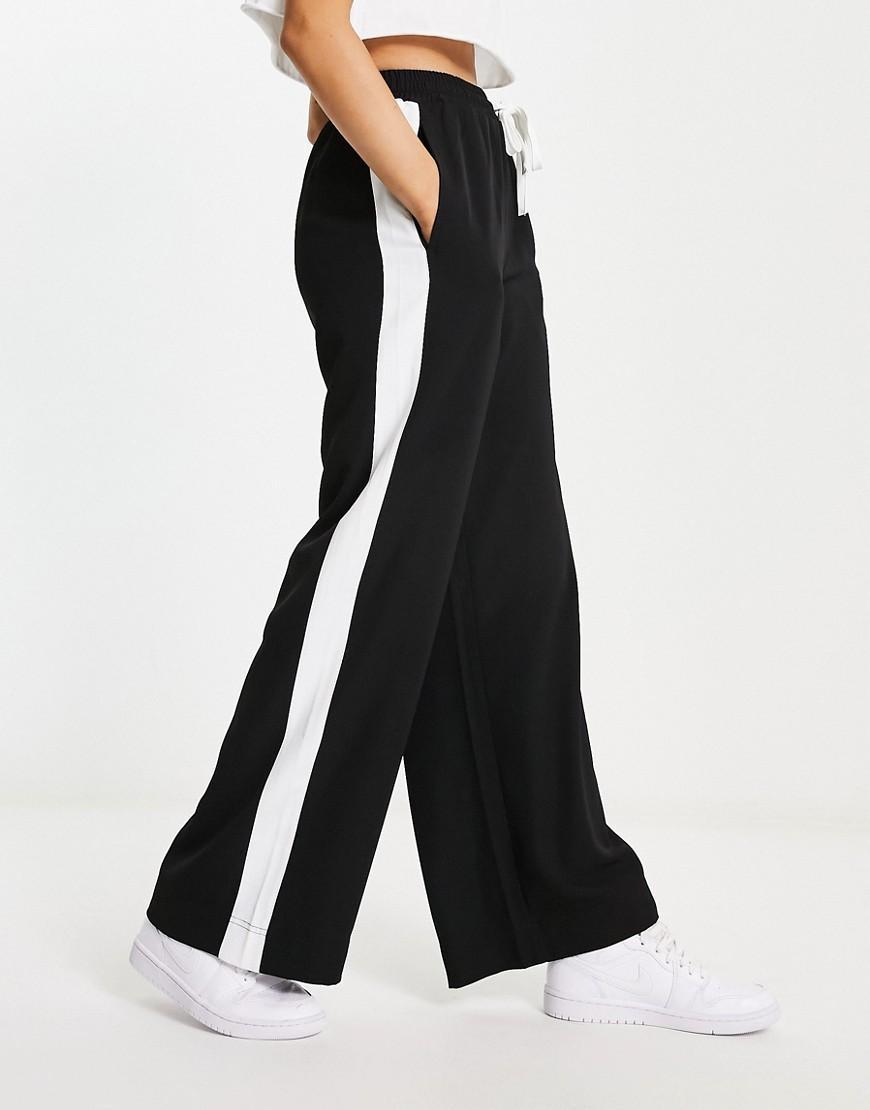 ASOS DESIGN pull on pants with contrast panel in black Product Image