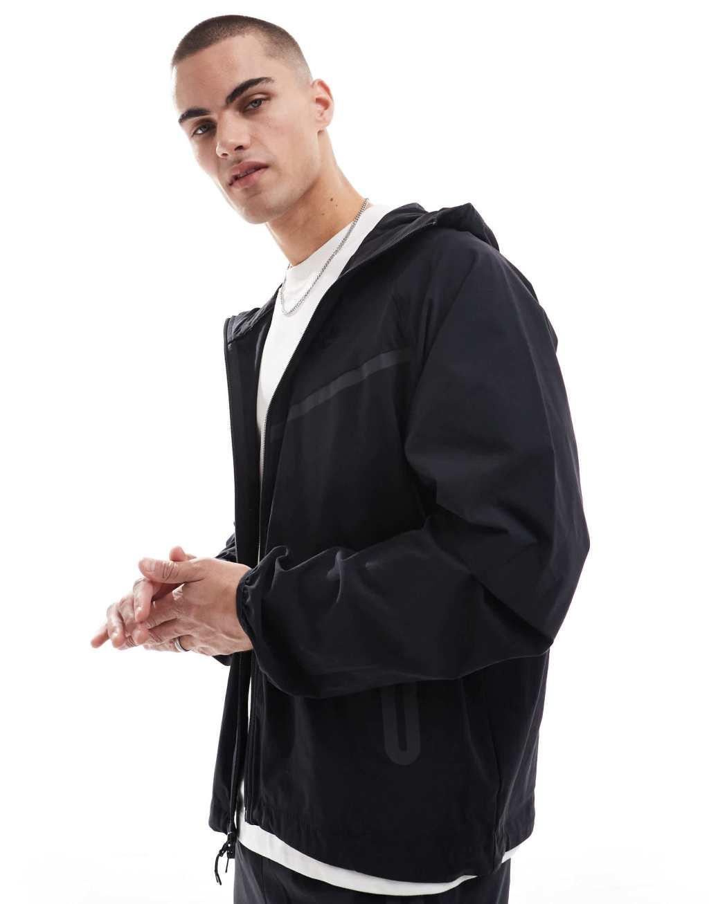 Nike Tech Woven full zip hoodie in black Product Image