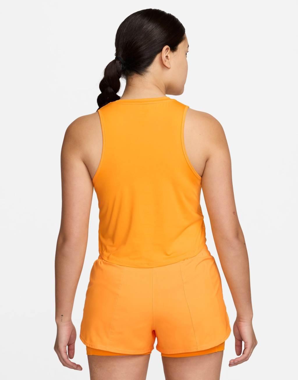 Nike One Training Dri-FIT cropped tank top in yellow Product Image