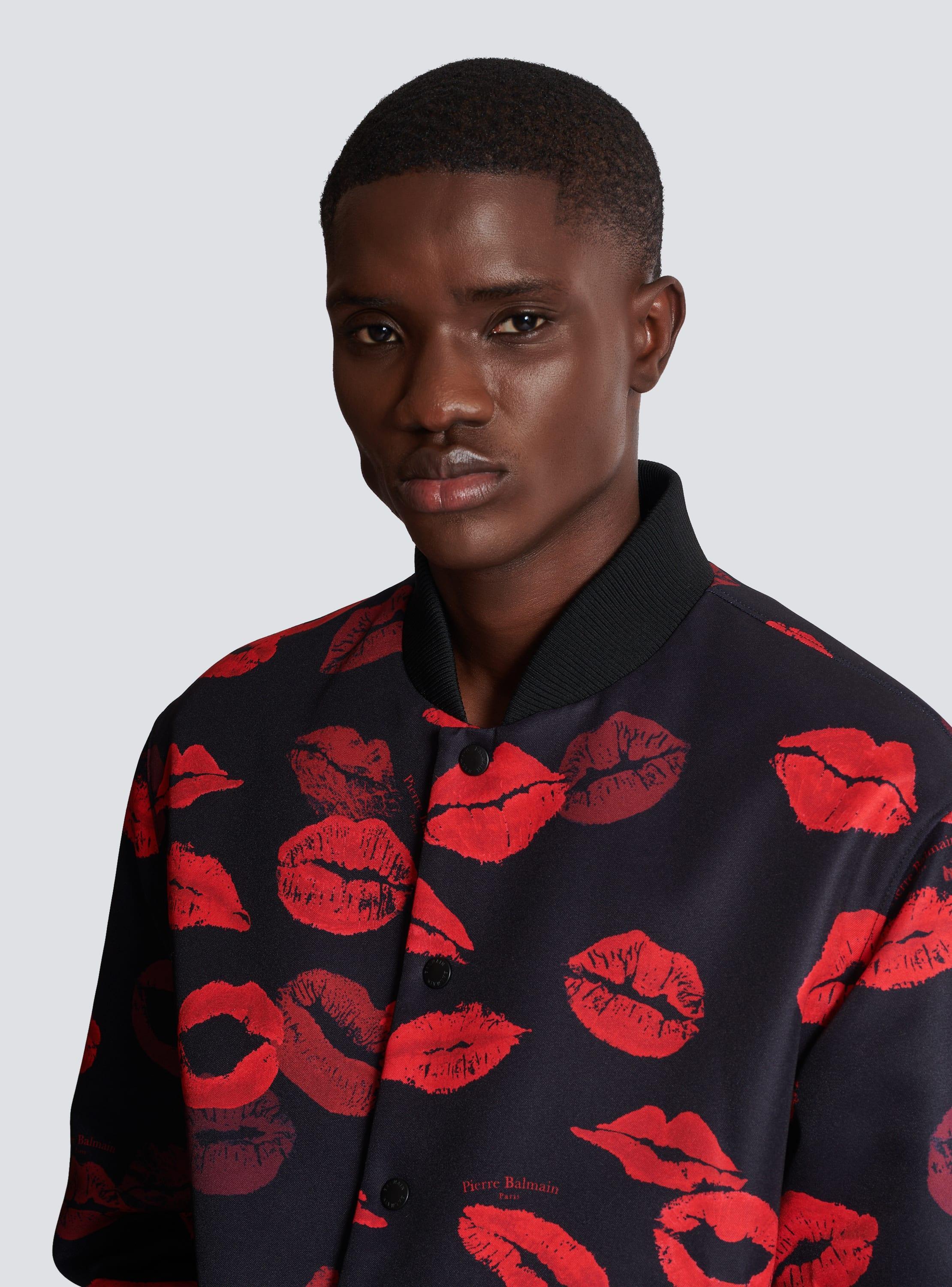 Reversible bomber jacket in plain and Kiss-print nylon Product Image