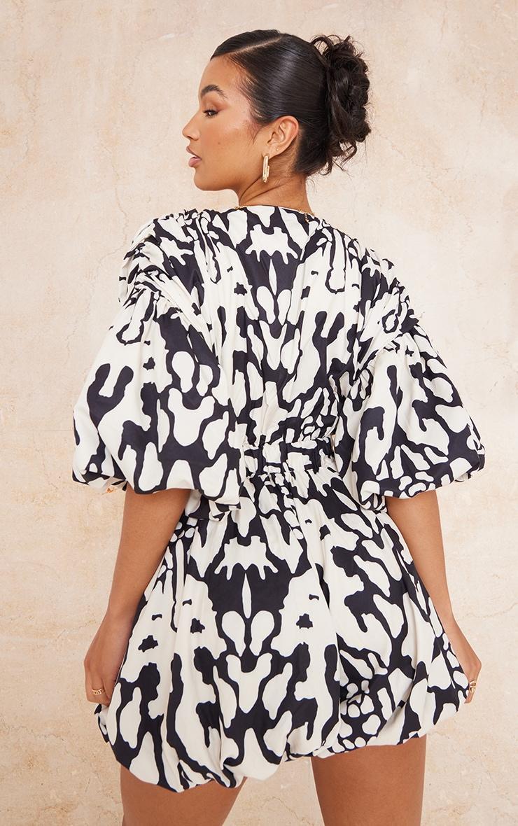 Black Print Plunge Puffball Hem Romper Product Image