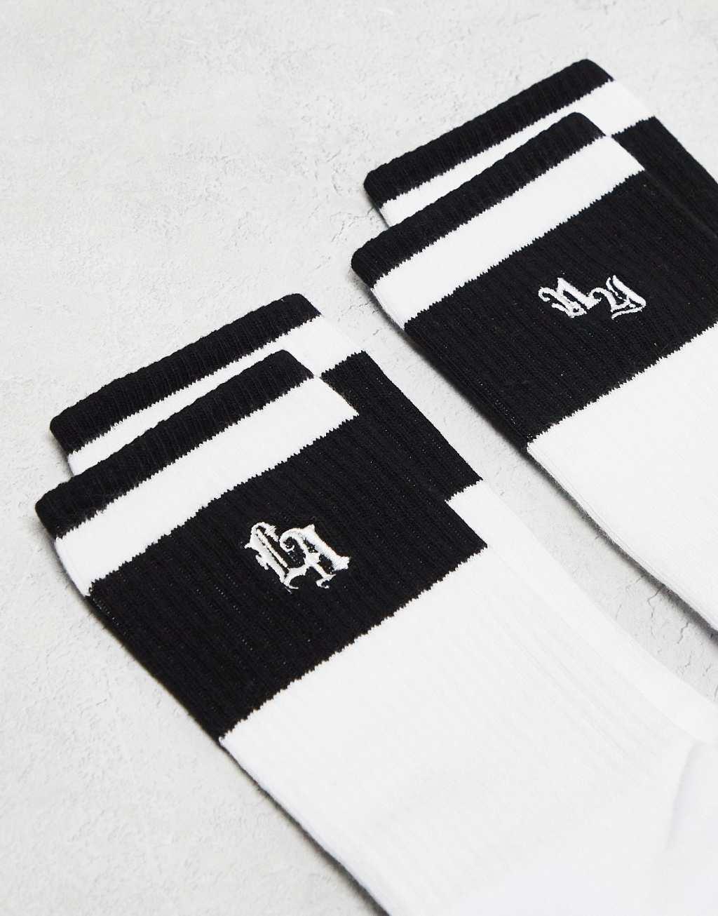 ASOS DESIGN 2 pack athletic striped socks with LA and NY artwork in white Product Image