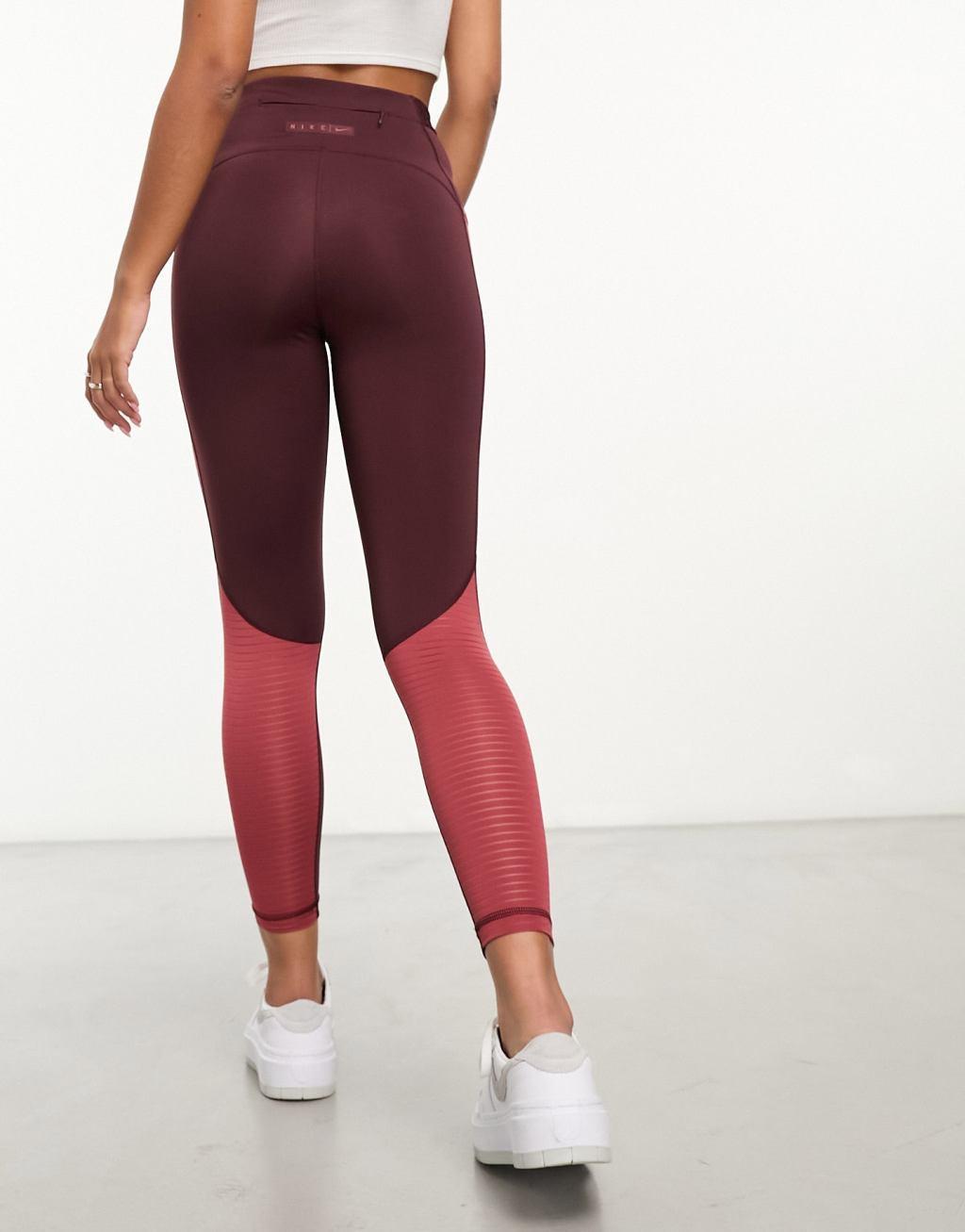 Nike Road To Wellness leggings in burgundy Product Image