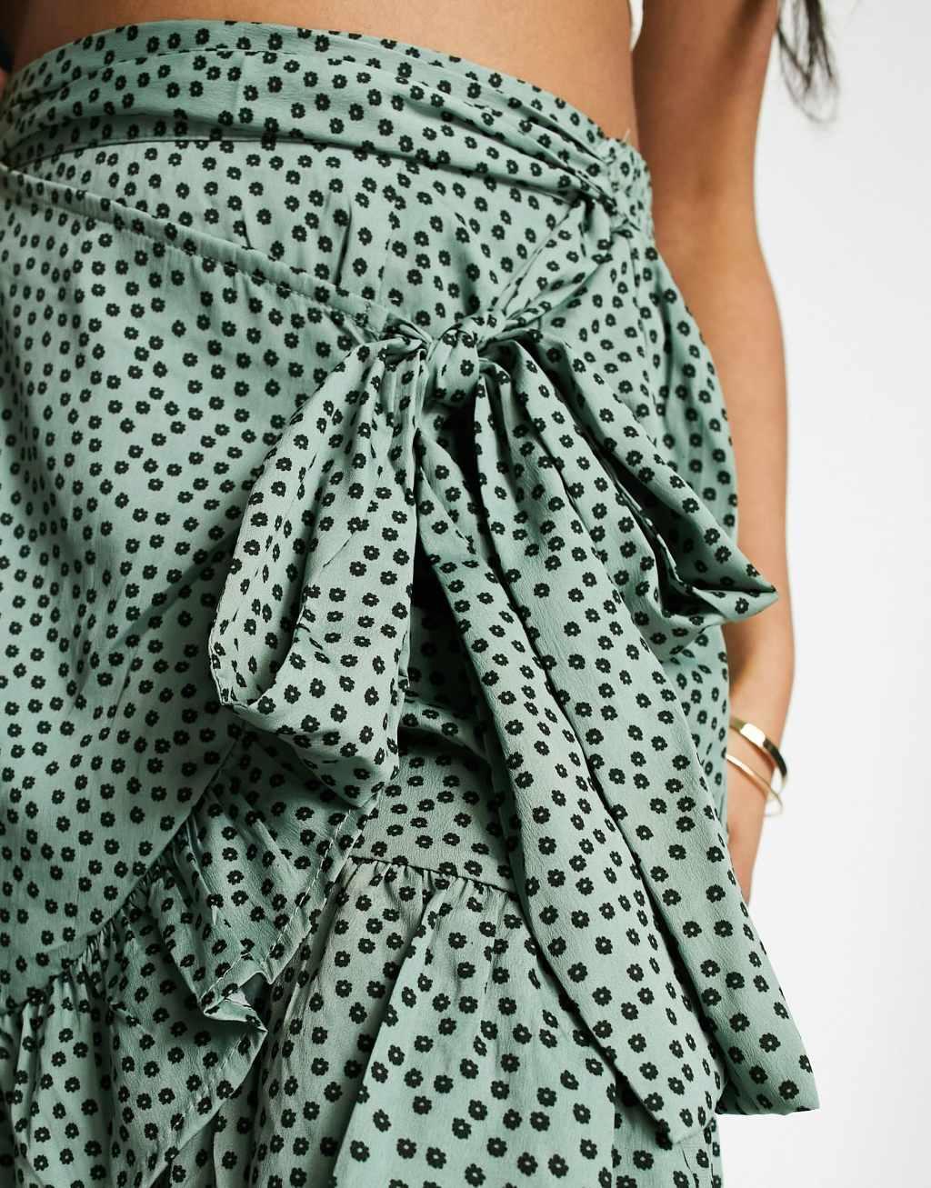 Only ruffle wrap mini skirt in green dot  Product Image