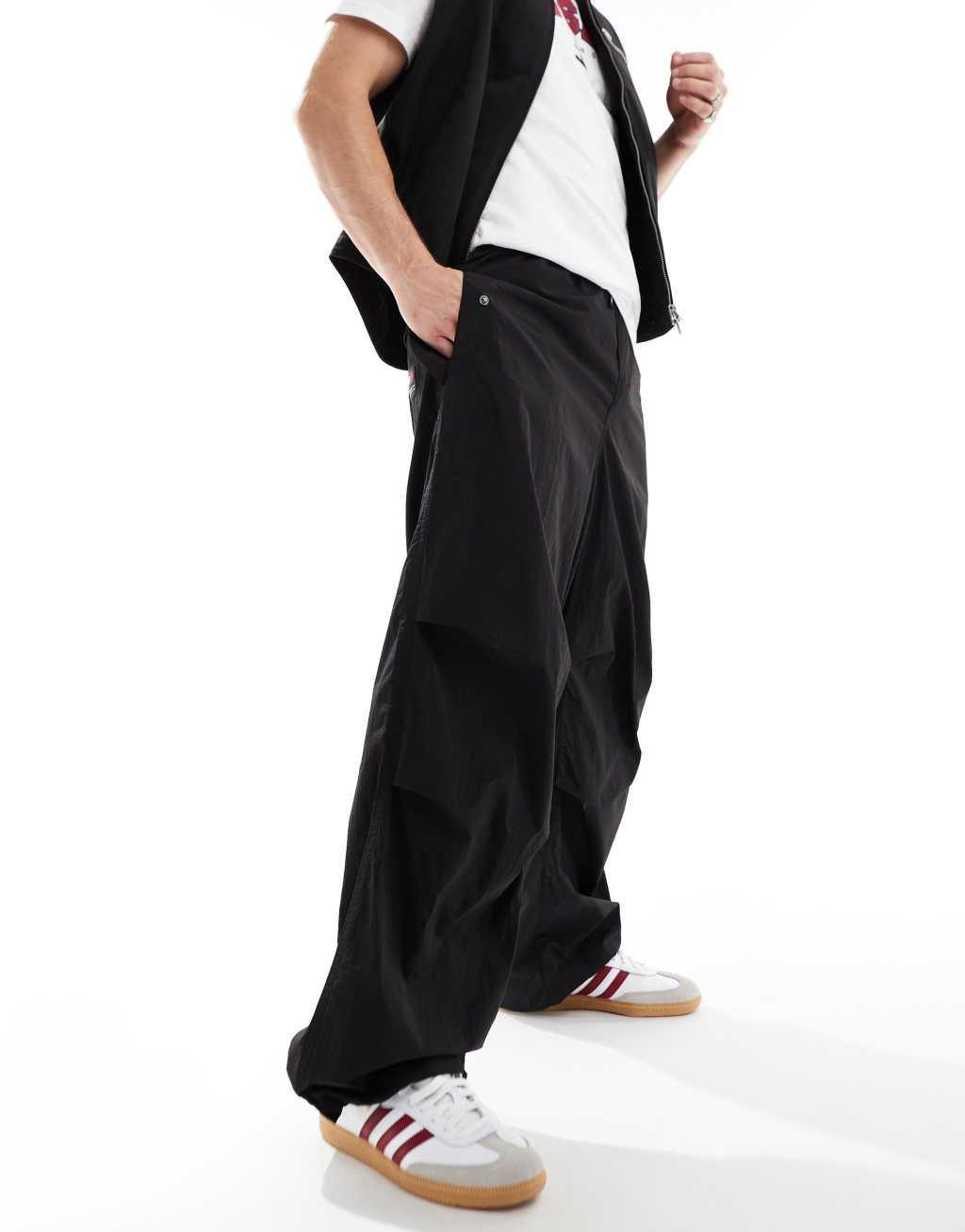 Tommy Jeans nylon parachute pants in black Product Image