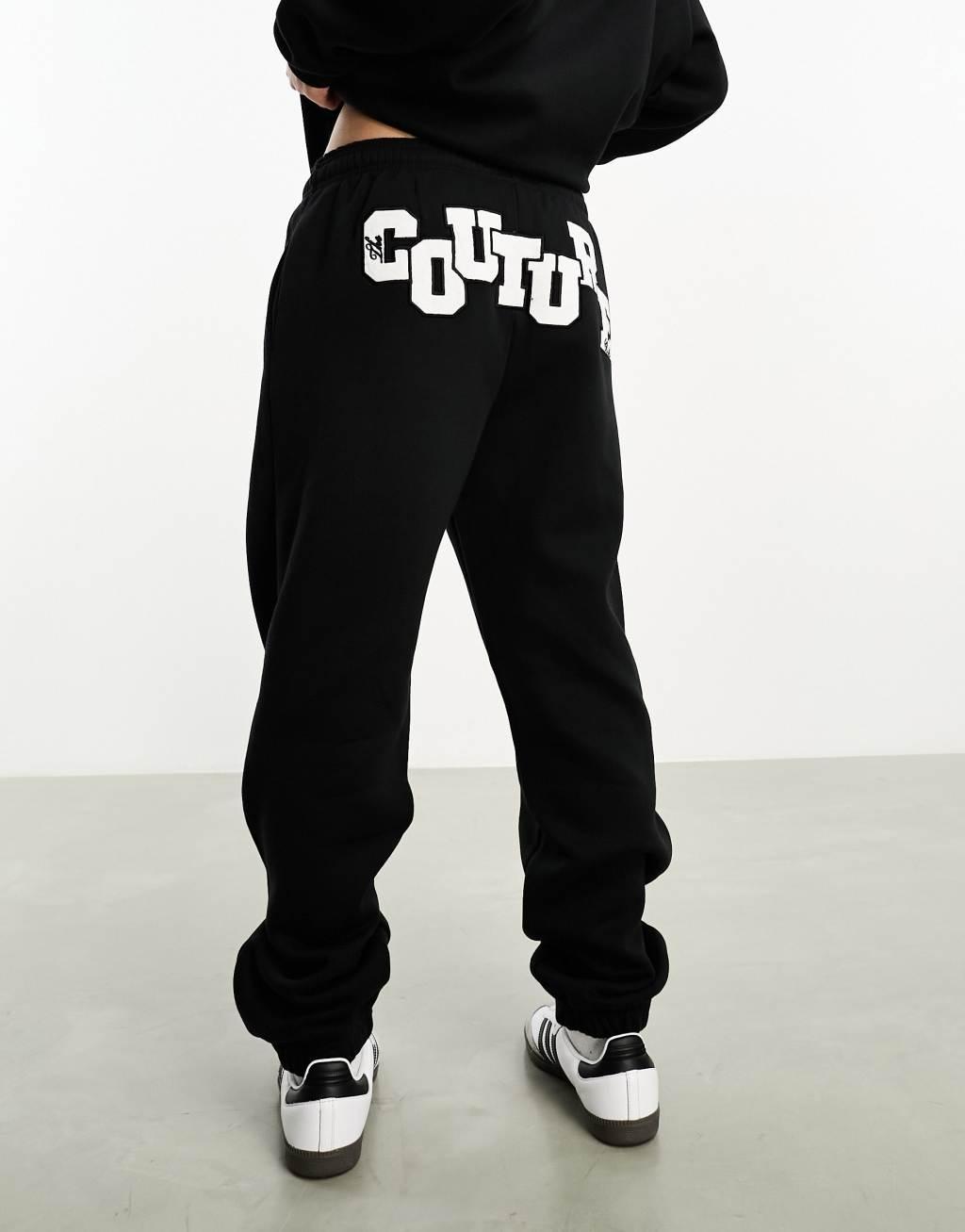 The Couture Club applique sweatpants in black Product Image