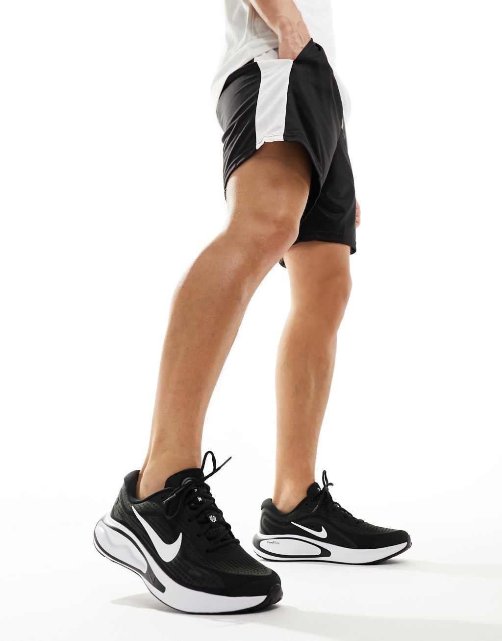 Nike Running Journey Run sneakers in black and white Product Image