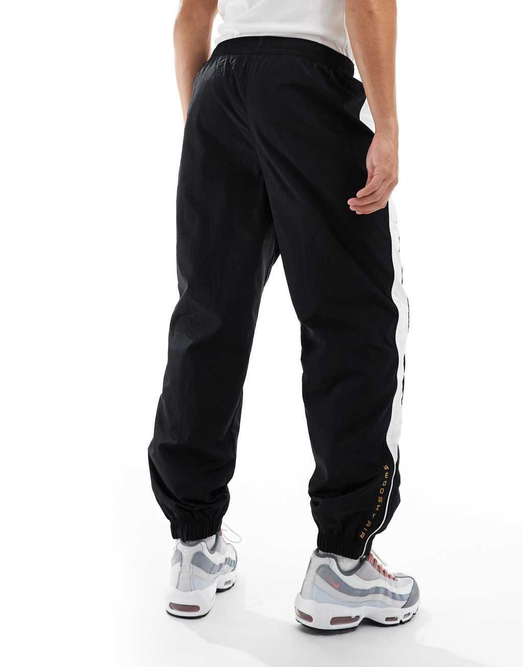 Nike Swoosh Air woven sweatpants in black and white Product Image