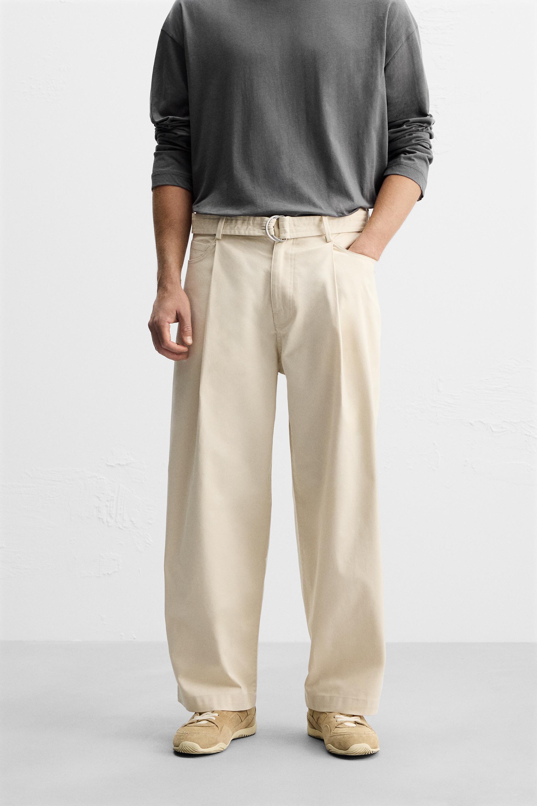 PLEATED PANTS WITH BELT Product Image