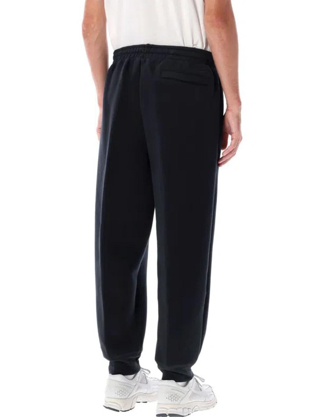 NIKE Reimagined Fleece Pants. - In Black Product Image