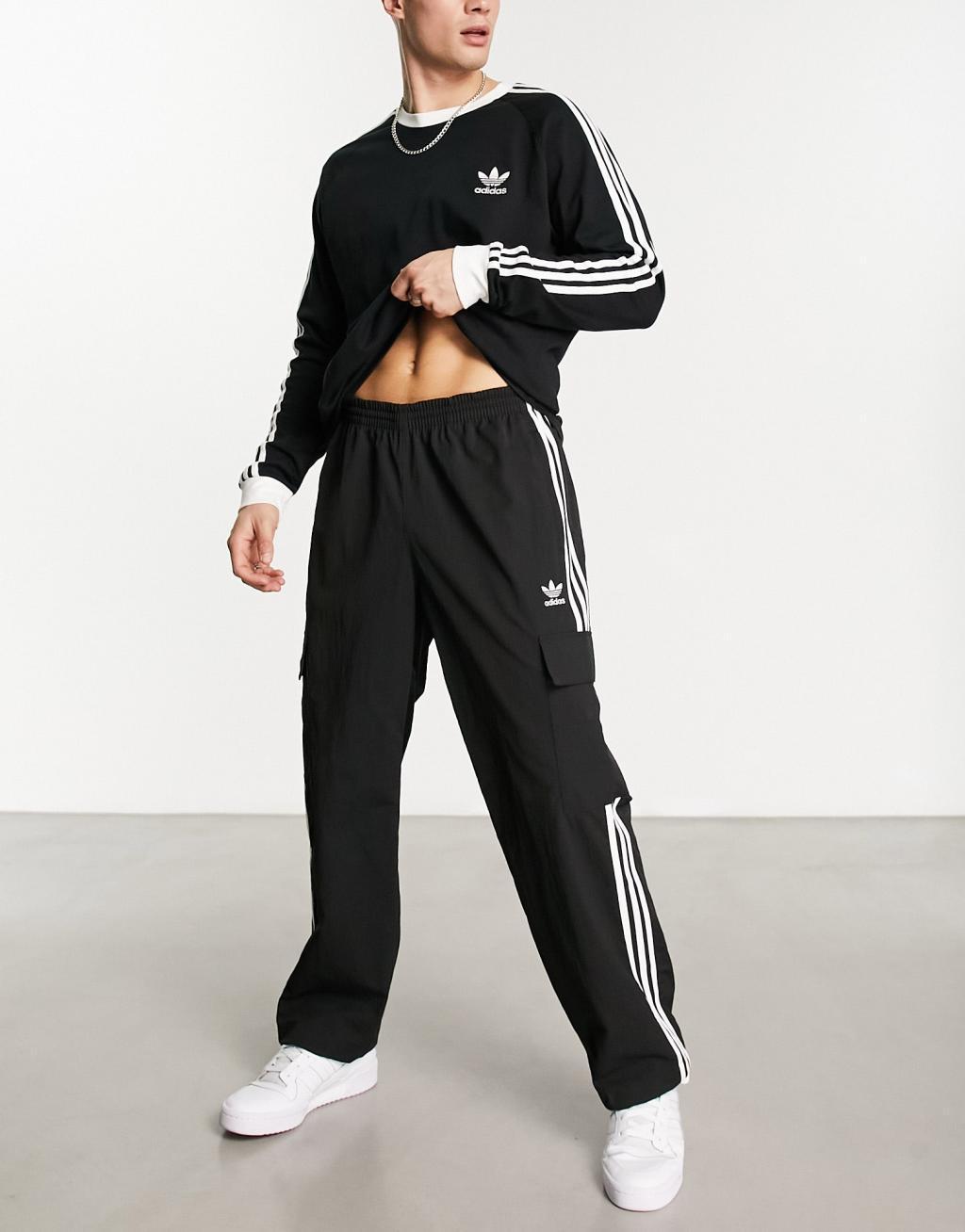 adidas Originals 3 stripe cargo pants in black Product Image