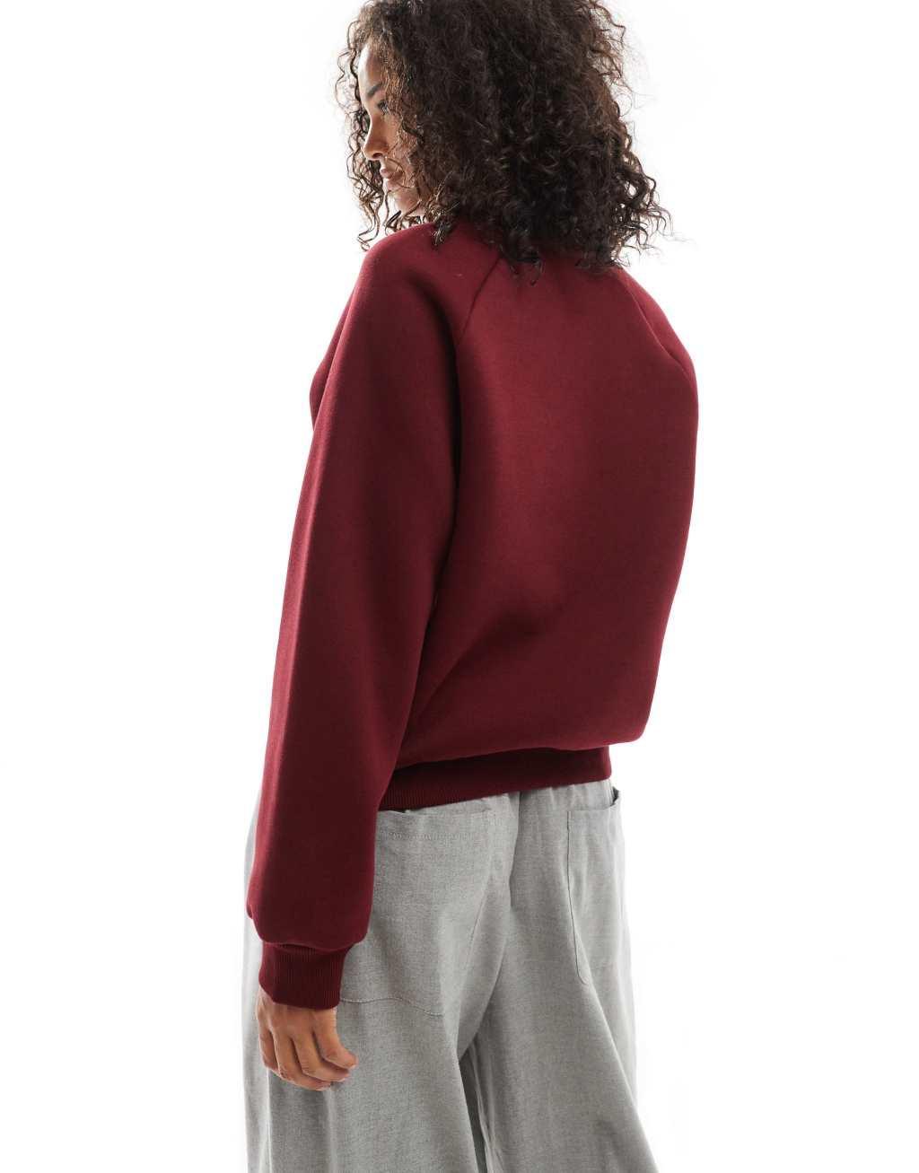 ASOS DESIGN raglan sweatshirt in burgundy Product Image