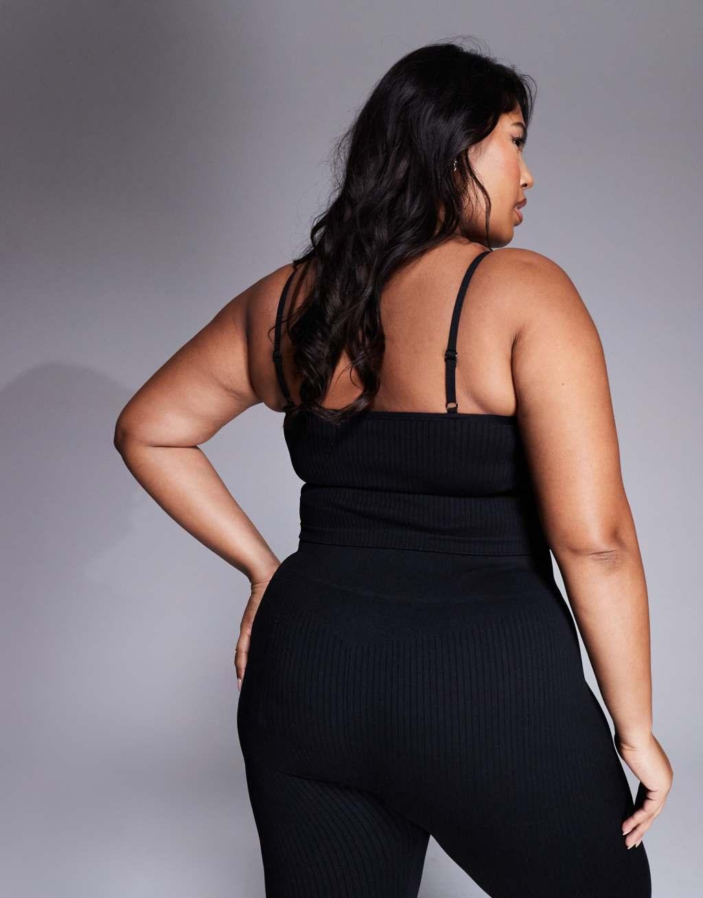 ASOS 4505 Icon Curve seamless ribbed yoga tank top with inner bra in black Product Image