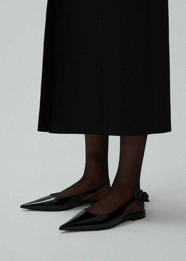 Slingback rose flats in black patent Product Image