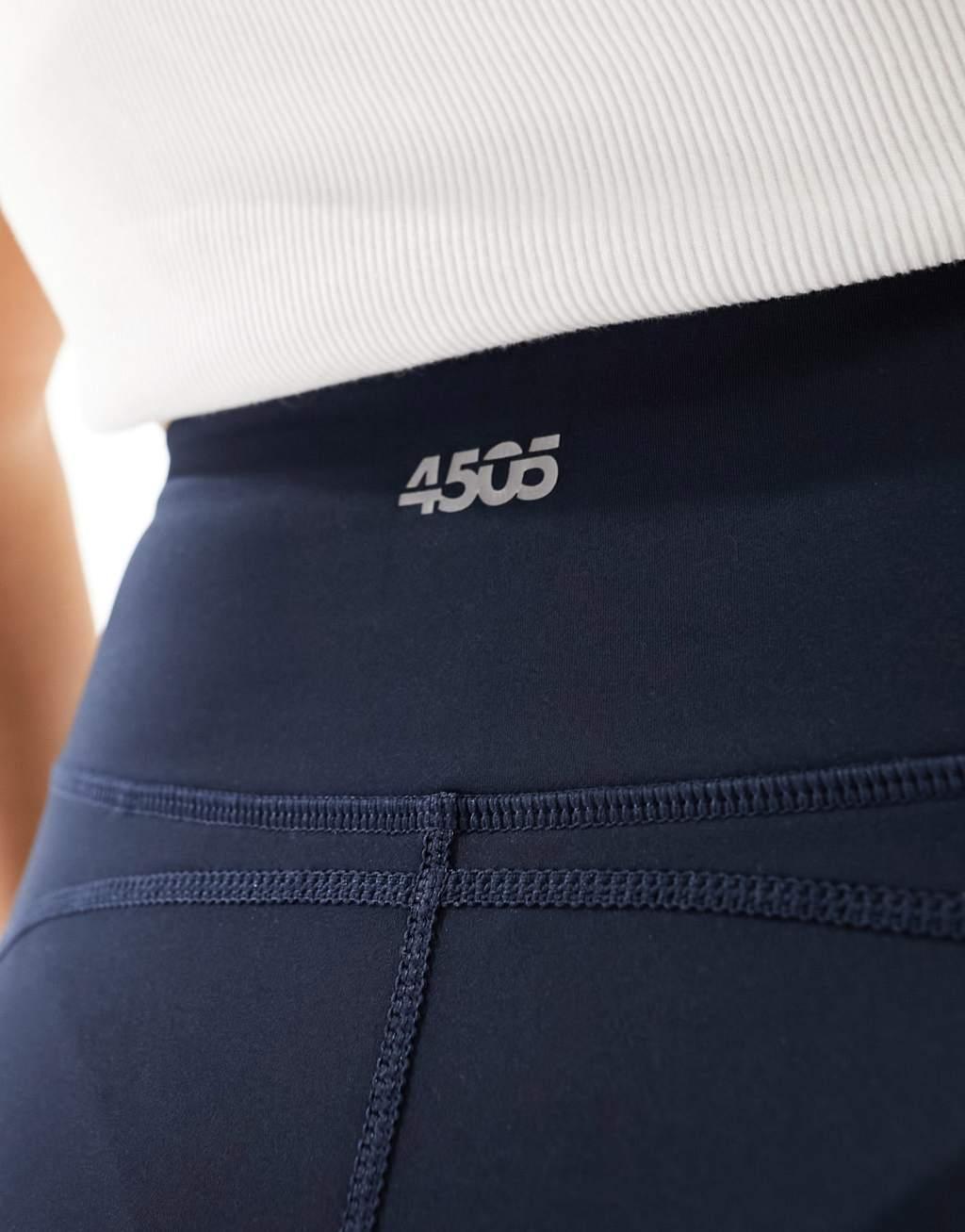 ASOS 4505 CurveIcon running tie waist gym leggings with phone pocket in navy Product Image