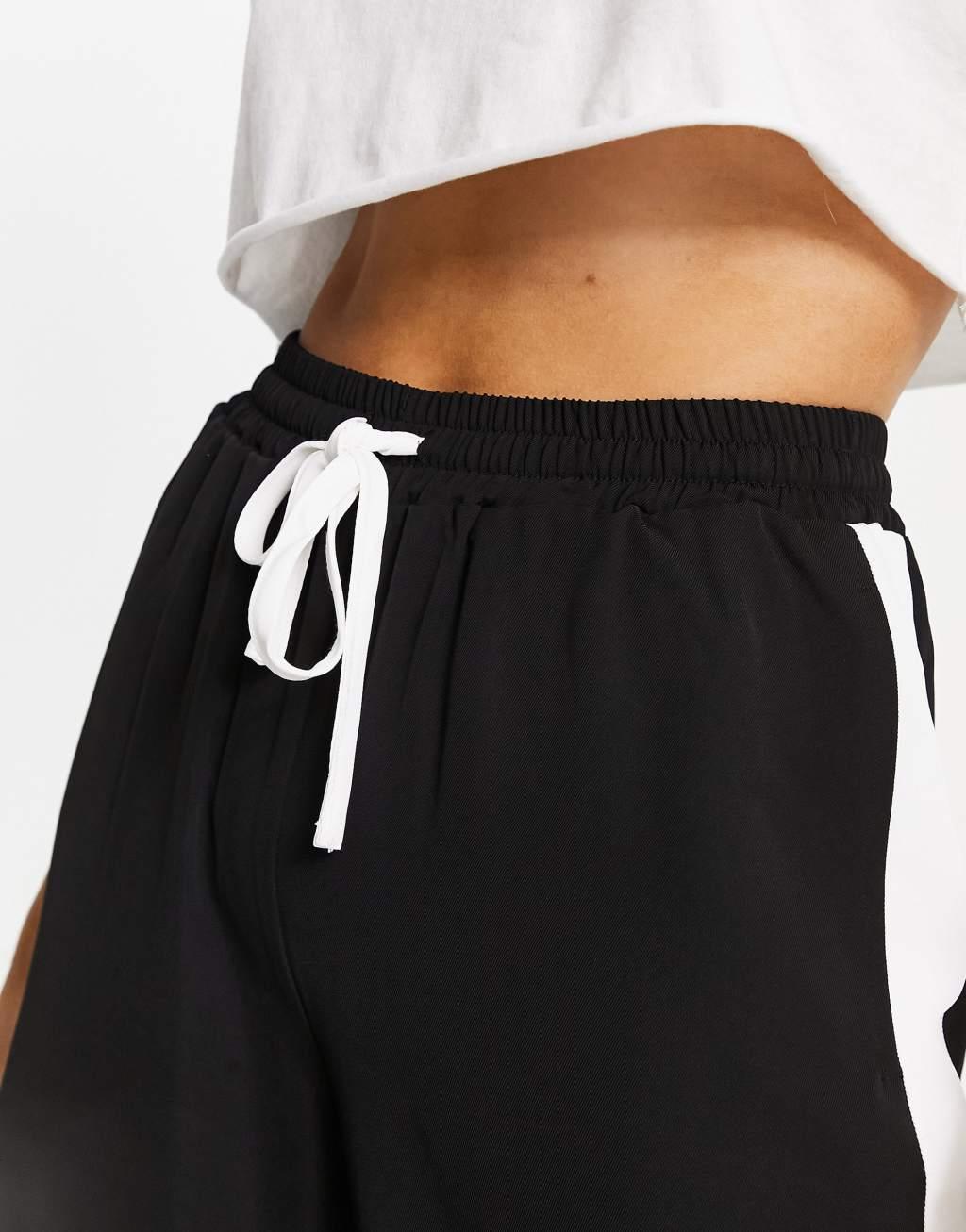 ASOS DESIGN pull on pants with contrast panel in black Product Image