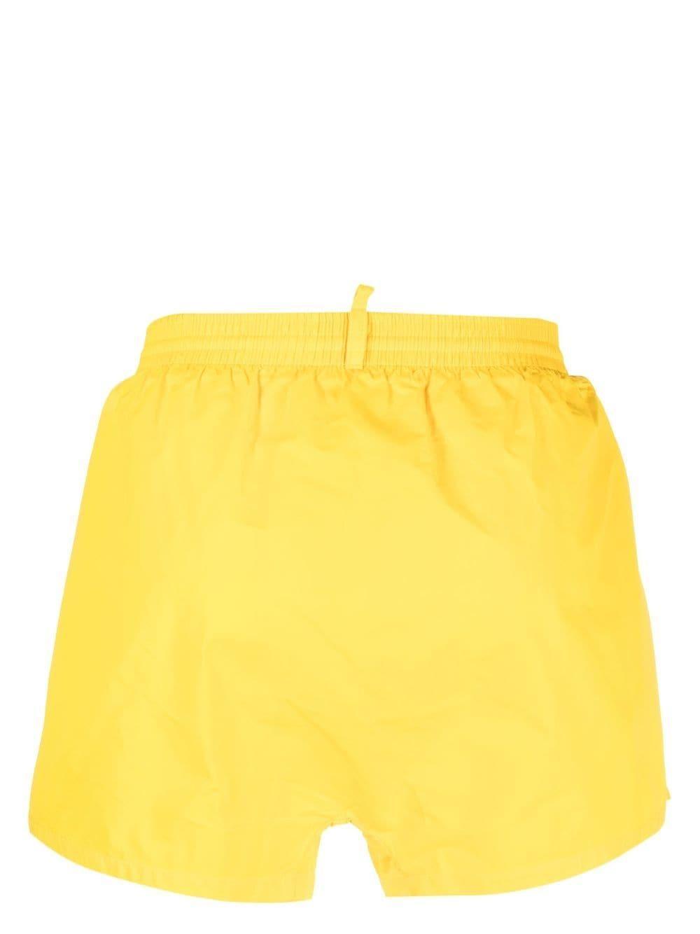 DSQUARED2 Logo-print Swim Shorts In Gold Product Image