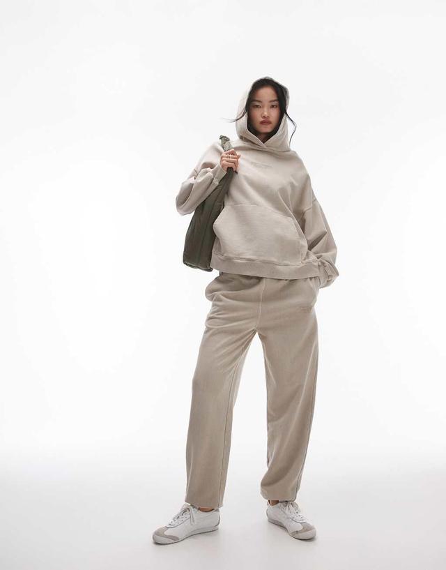 Topshop Community graphic cuffed sweatpants in stone Product Image