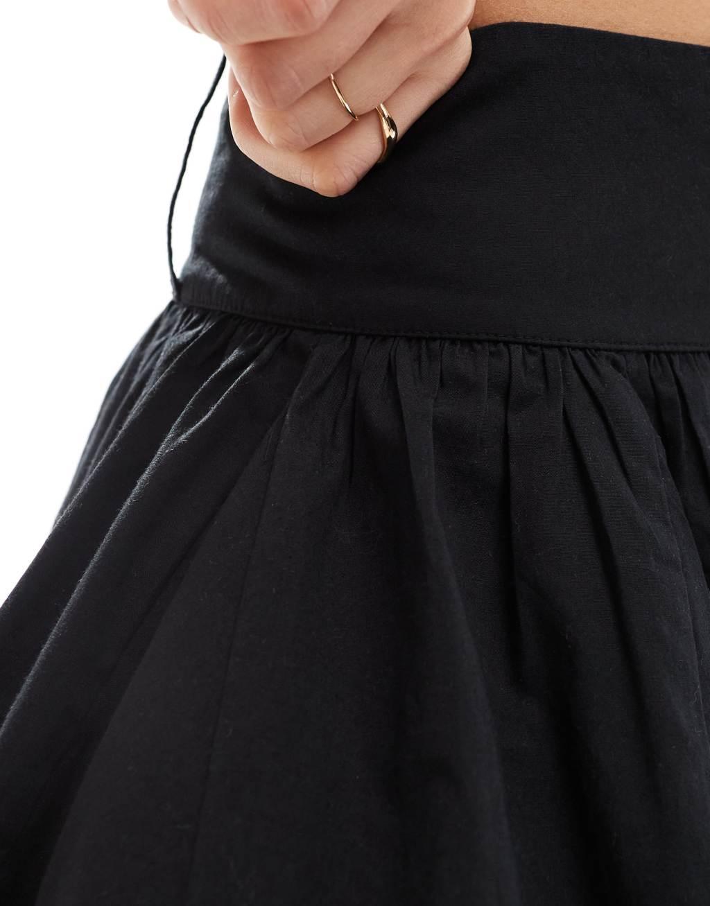 COLLUSION cotton flippy mini skirt in black Product Image