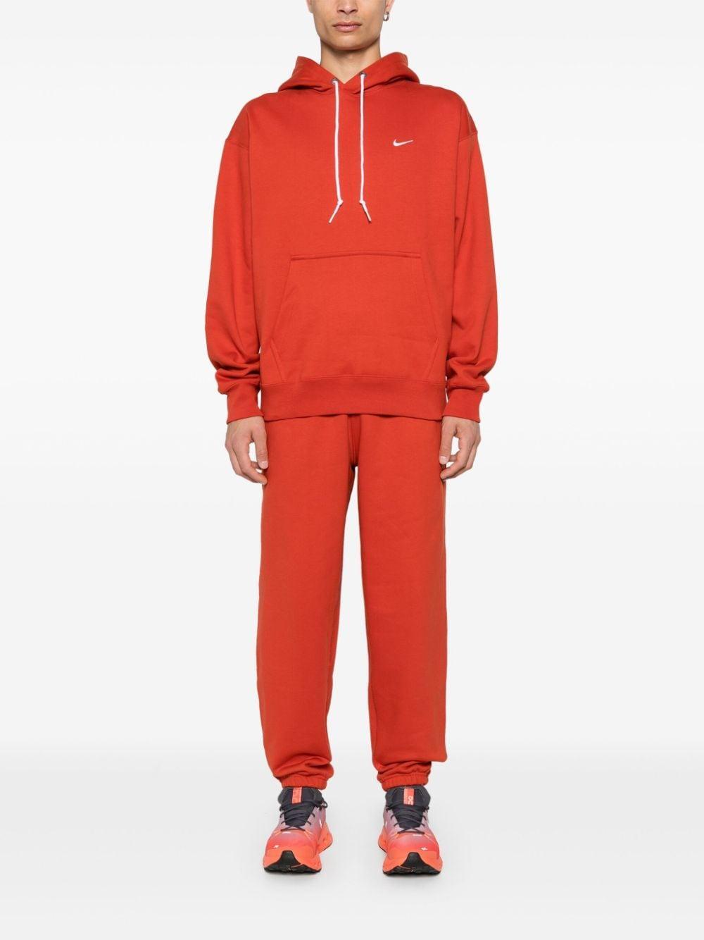 NIKE Solo Swoosh Hoodie In Rot Product Image