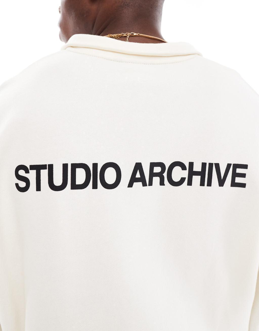 ASOS DESIGN boxy oversized 1/2 zip with studio archive back print in ecru Product Image