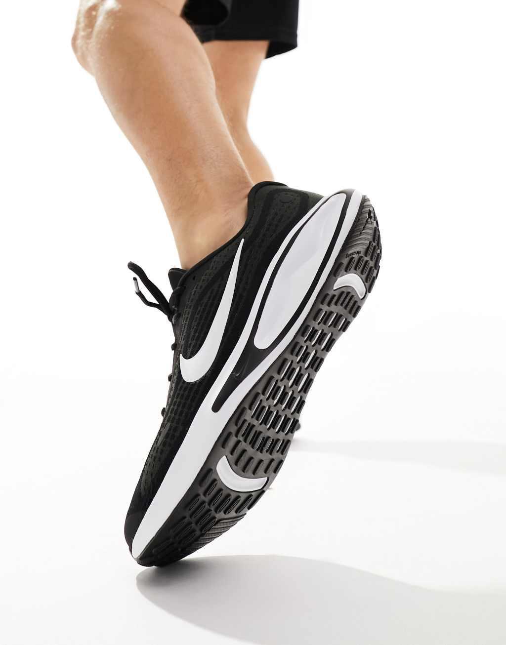 Nike Running Journey Run sneakers in black and white Product Image