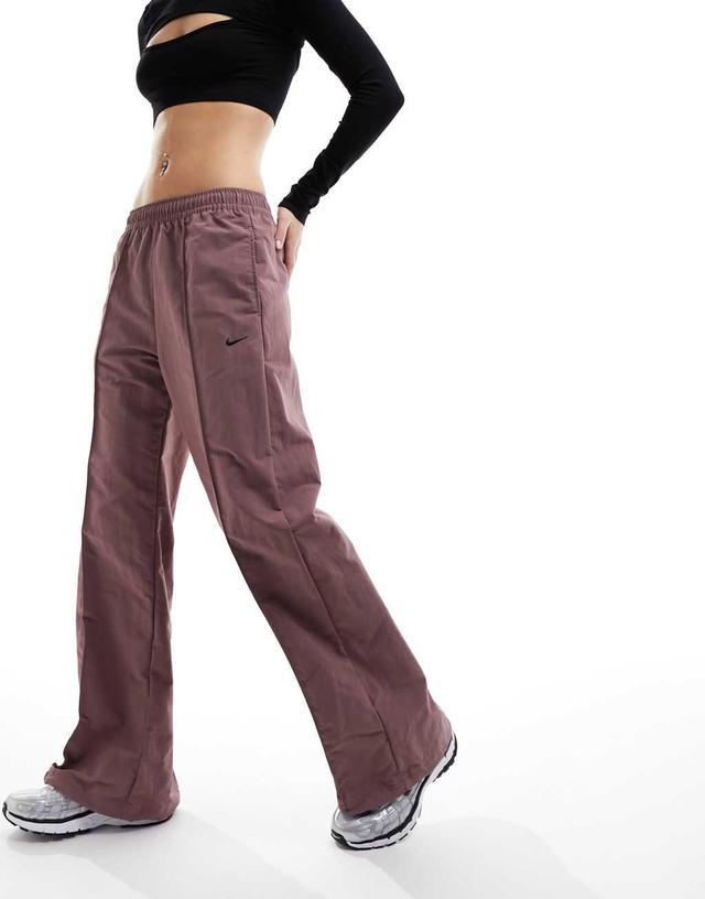 Nike Trend woven baggy parachute pants in smokey mauve Product Image