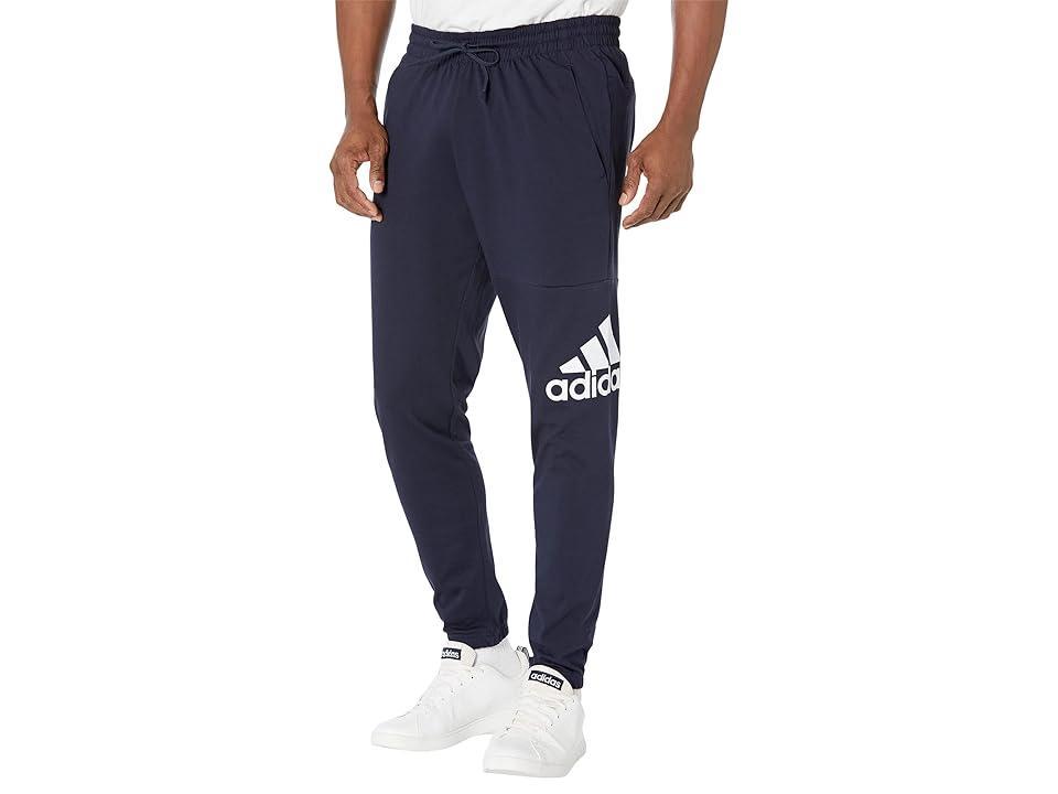 Mens adidas Essentials Badge of Sport Jersey Tapered Pants Dark Blue Product Image