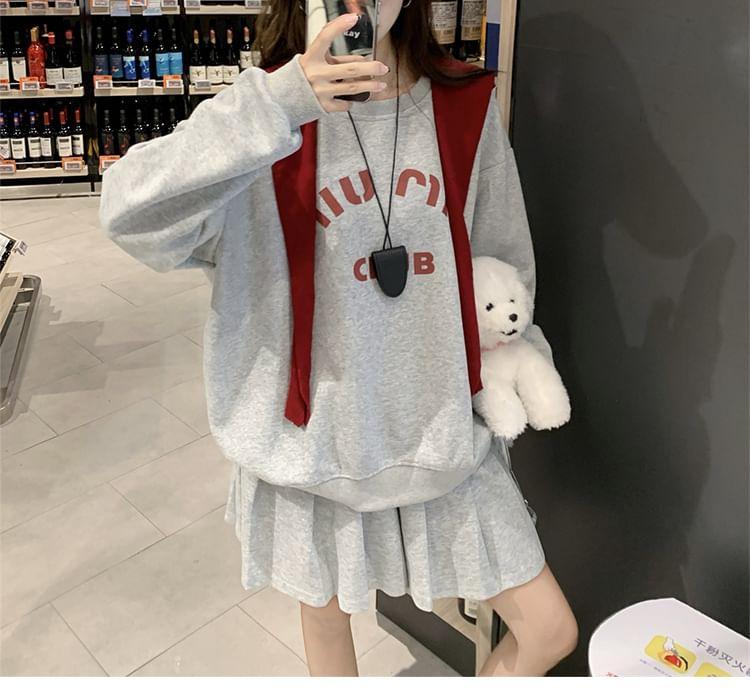 Round Neck Lettering Print Sweatshirt / High Waist Plain Pleated Mini A-Line Skirt / Plain Shawl Product Image