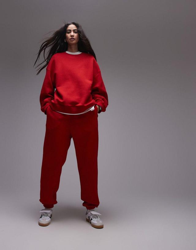 Topshop cuffed sweatpants in red Product Image