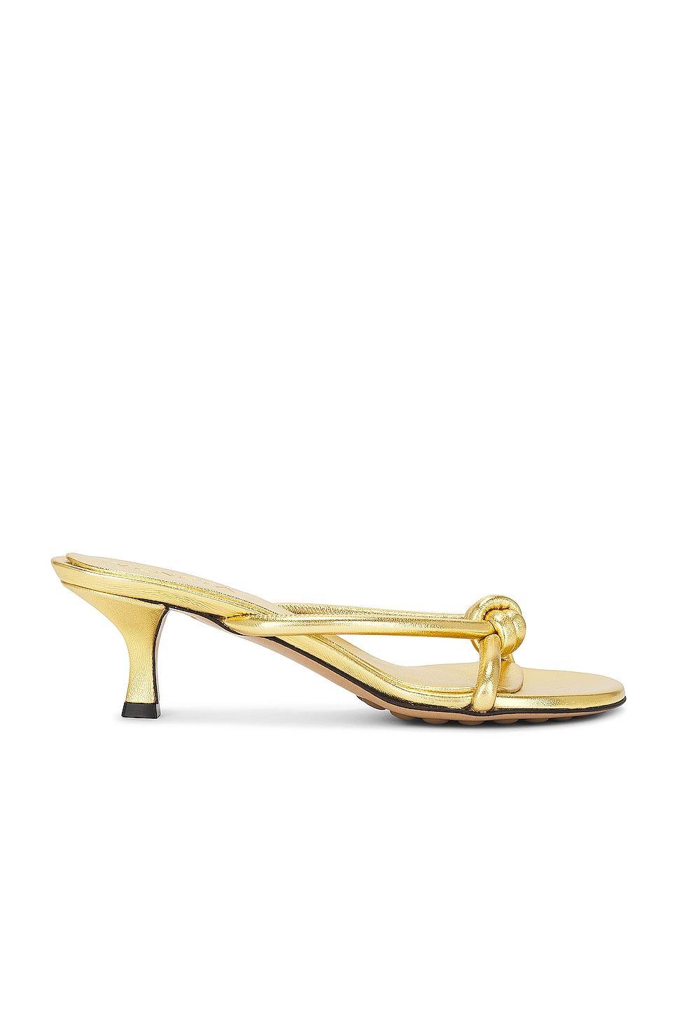 Bottega Veneta Metallic Blink Mule Sandal in Gold - Metallic Gold. Size 36 (also in 38.5, 39). Product Image